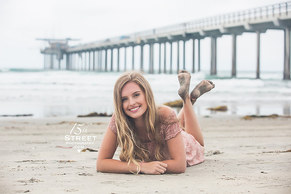 beach senior portrait laying on beach sandy feet california 15th Street Photography